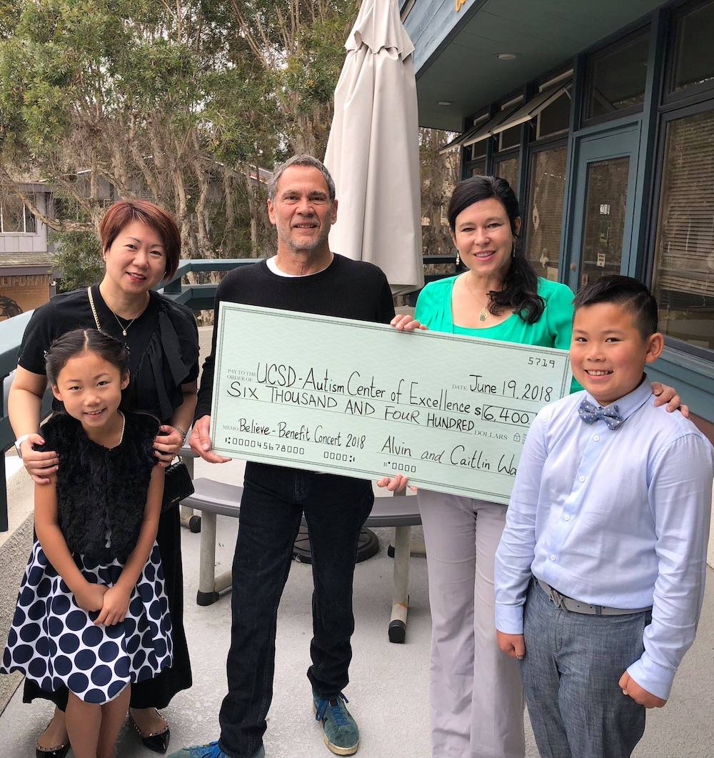 UCSD ACE receives check from Believe Fundraising Concert