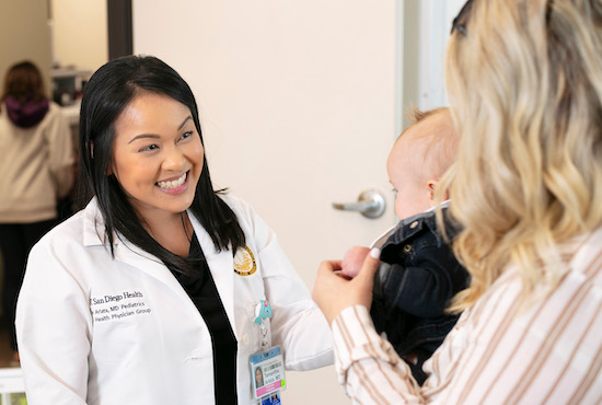 Dr. Arlata with baby and mother