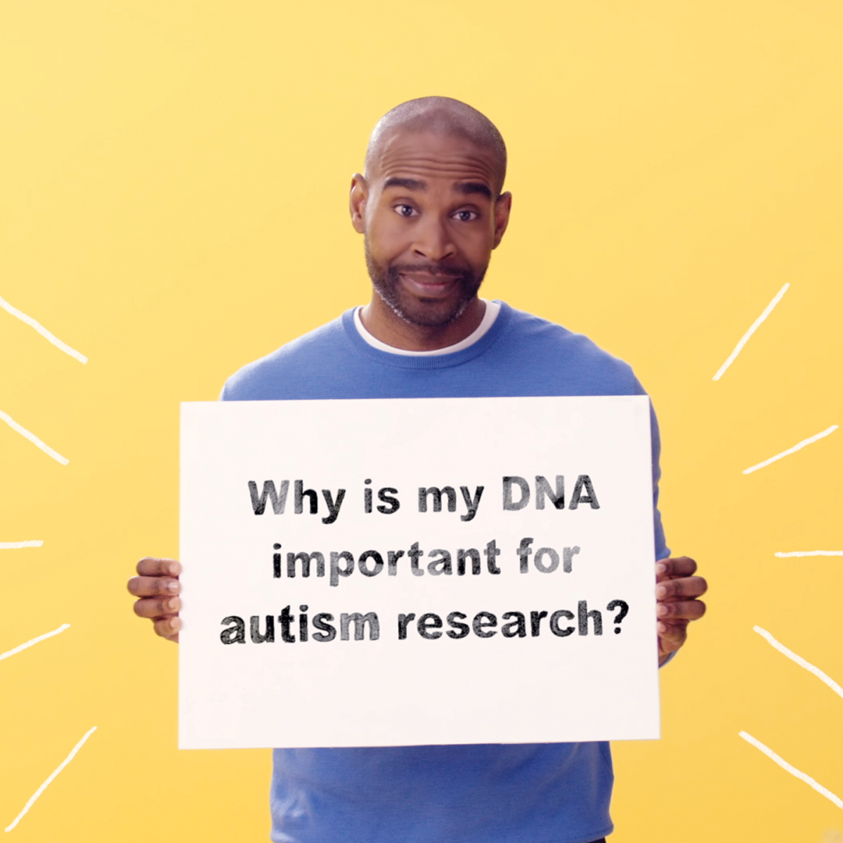 man holding sign that says, "Why is my DNA improtant for autism research?"