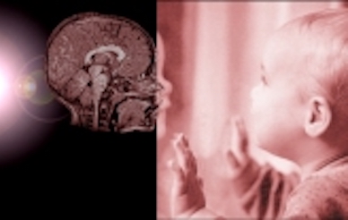 brain scan next to baby touching screen