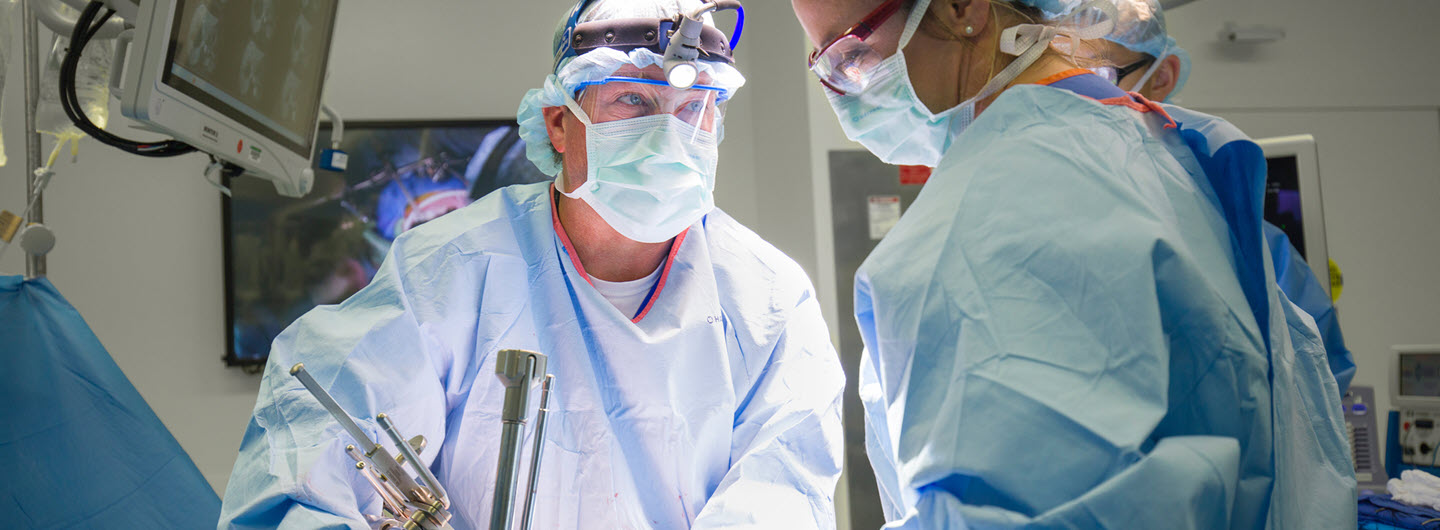 uc san diego surgeons in scrubs in the operating room performing a surgery