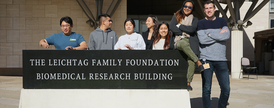 3 of 9, zheng lab members 2019 standing in front of biomedical building