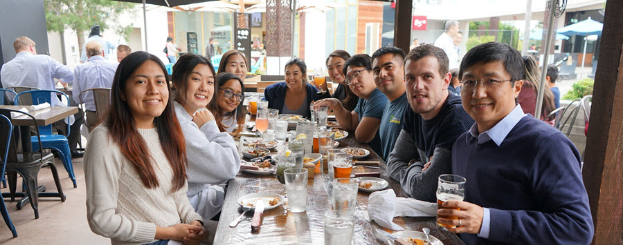 5 of 10, zheng lab members sitting at lunch table after meal